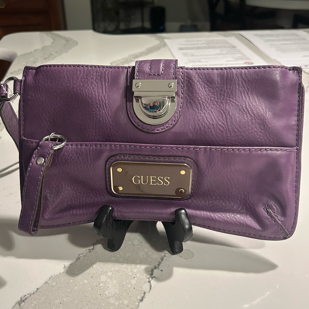GUESS Purple Leather Wristlet Clutch with Gold-Tone Plate And Silver Hardware
